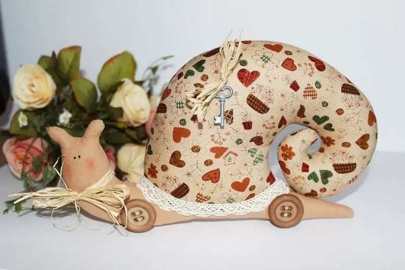 Cute snail-tilda will undoubtedly appeal to your child